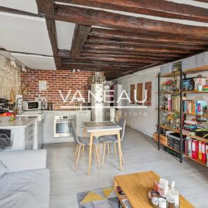 Paris IIe - Appartement deux pièces de charme en étage élevé